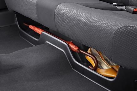 Under-seat tray to stash your… umbrellas.